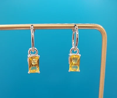 Серебряные сменные серьги-кольца из желтого и персикового цветов - Изображение 1 из 4