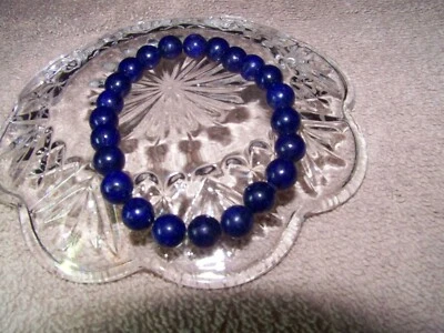 Lapis Lazuli blue/white/gold 2 1/2 inch 8 mm round beads on elastic bracelet - Image 1 of 3