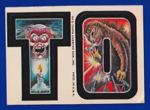 TO 1974 TOPPS MONSTER INITIALS STICKER white back VG-EX - Picture 1 of 2