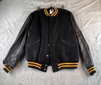 Chaqueta de bombardero universitaria vintage de cuero Butwin de lana negra y amarilla Foto 1 de 4