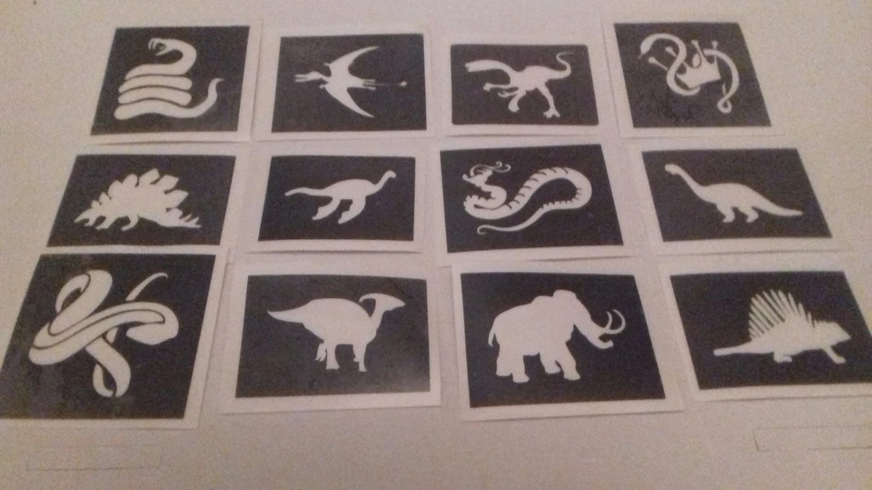 DAZZLE GLITTER TATTOOS 30 stencil a tema dinosauro e serpente per tatuaggi glitter / pittura viso