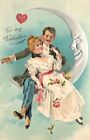 PFB Valentine Postcard 6859 Happy Lovers sit on Silver Crescent Man in Moon