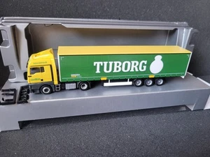 MAN TGX Contino Transport A/S 6330 Padborg Danmark TUBORG Beer Bahntrailer - Bild 1 von 7