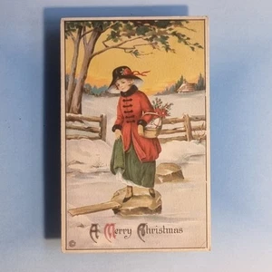 Christmas Postcard 1920 Snow Scene Lady Red Coat Basket Gloves Boots - Picture 1 of 2