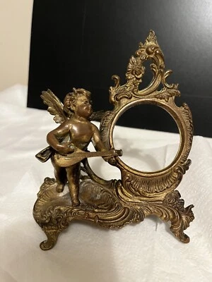 Antiguo reloj francés de bronce latón querubín ángel o estatuilla con marco de fotos Foto 1 de 4