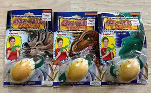 Huevo vintage Spin Master Grow Things dinosaurios (3) Brontosaurus Trex Triceratops - Imagen 1 de 14