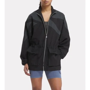 ANINE BING X REEBOK WOMENS XSMALL WINDBREAKER JACKET CINCH WAIST BLACK GRAY NEW - Picture 1 of 16