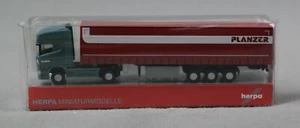 HERPA 066860 N,1:160 Scania R Tieflader Gardinenplanen-Sattelzug "Planzer" (CH) - Picture 1 of 5