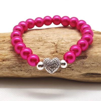 Pulsera elástica elástica elástica de perlas de vidrio rosa intenso de 8 mm y dije de corazón de plata tibetana Foto 1 de 4