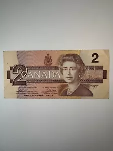 Billete de dos dólares Thiessen/Cuervo de Canadá 1986 - Imagen 1 de 2