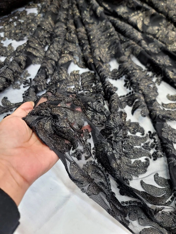 Embroidered Stretch Lace Apparel Fabric Sheer Black Floral Gold Accent - 52" Wid - Image 1 of 4