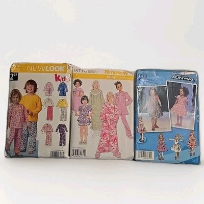 Lot of 3 Simplicity Childrens Patterns Size 1/2-14 Pajamas Gown Dress Robe Uncut - Image 1 of 4