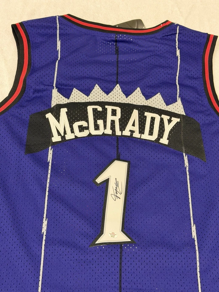 Camiseta deportiva de baloncesto firmada por Tracy McGrady de los Toronto Raptors de la NBA certificado de autenticidad Foto 1 de 4
