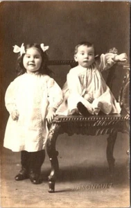  VINTAGE RPPC POSTCARD toddler Boy & Girl Portrait -Pasonault photo Williston ND - Picture 1 of 2
