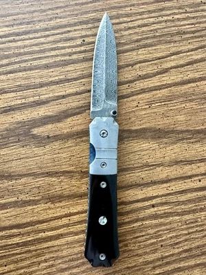 Mel Pardue CUSTOM Coffin Handle Folder --  Buffalo Horn -- MOP -- Damascus - Image 1 of 4