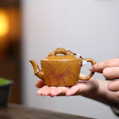 Pequeña tetera china de kungfu de 100 ml tallada a mano Orquídea Real Yixing Zisha Foto 1 de 4