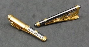 Dunhill Juego de 2 barras de clips de corbata doradas y negras de 6,5 cm con forma redonda y cilíndrica - Imagen 1 de 4