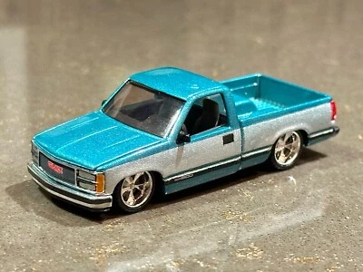 M2 Machines 1989 GMC Sierra 1500 LT4 Custom Lowered Teal x Silver TWO-TONE 1:64 - Image 1 of 4