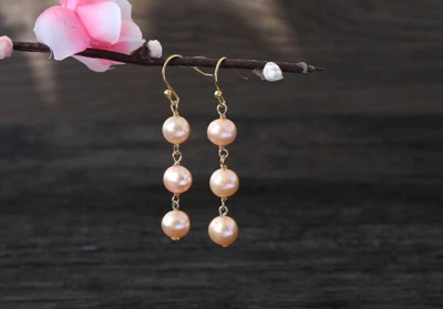 A pair 8mm south sea pink round pearl earring 14k - Image 1 of 2