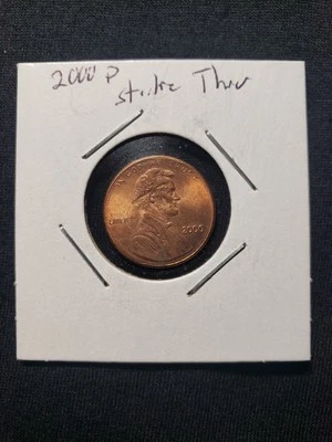 2000 P LINCOLN ERROR CENT STRIKE THRU DEBRIS ERROR ON FRONT  OVER LINCOLN - Image 1 of 4