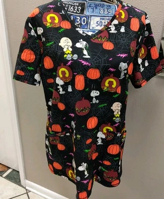 NWT Peanuts Snoopy Halloween Scrub Top, Charlie Brown/Great Pumpkin, Women's M - Image 1 of 4