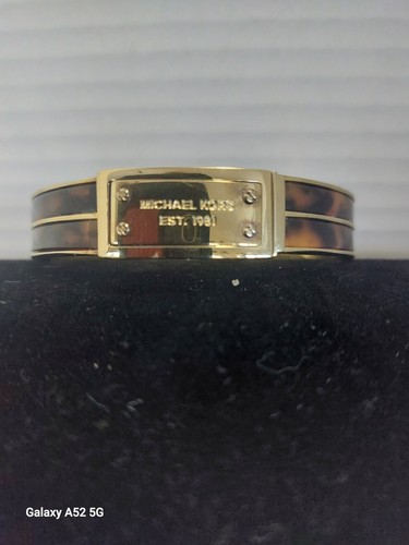 Bracciale Michael Kors in oro con tartaruga lungo 8 pollici
