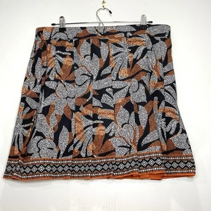 NUEVO CON ETIQUETAS CHICO'S Skort Plisado Negro Blanco Naranja Quemado Elastizado Chico Talla 2 (US 12) - Imagen 1 de 7