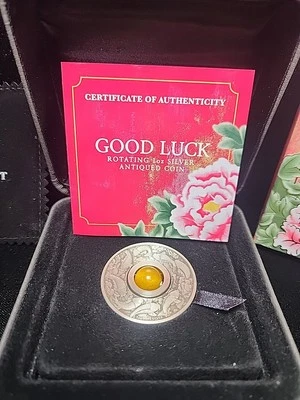 2018 $1 Good Luck Rotating topaz 1oz Silver Antiqued Coin RTC#004  - Image 1 of 4