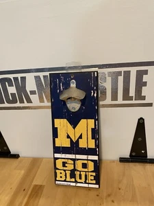 Michigan Wolverines BOTTLE OPENER SIGN 5"X11" HARDBOARD W/ CAST METAL OPENER - Picture 1 of 3