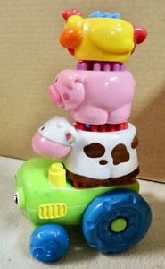 Fisher Price Stackable Tractor with 3 Bristle blocks, cow, pig, chicken (A) - Picture 1 of 6