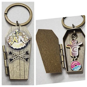 Universal Studios Orlando Voodoo Doughnut Doll KEYCHAIN Coffin Opens Donut Insid - Picture 1 of 18
