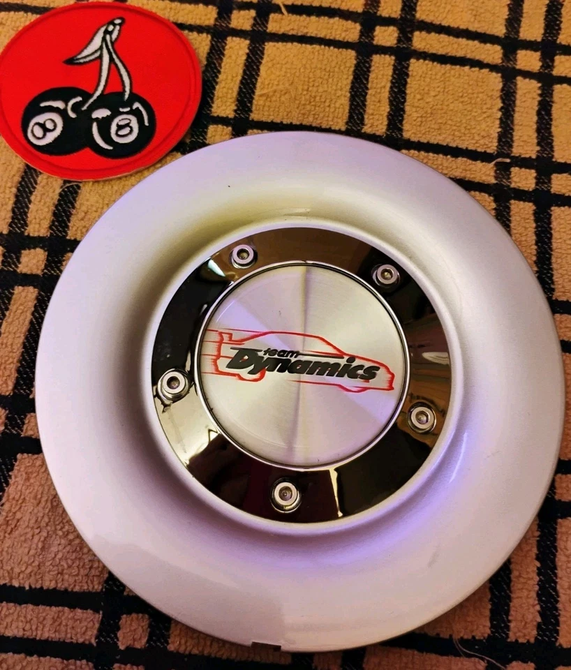 x1 New Team Dynamics 6-1/16" OD Part #LG63A And #LG63B Silver Wheel Center Cap.  - Image 1 of 4