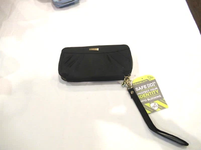 Cartera Travelon tela negra, interior morado, nueva con etiquetas Foto 1 de 4