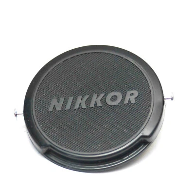 GENUINE OEM BRANDED NIKON NIKKOR 52MM FRONT LENS CAP CHROME BUTTON CLIP ON - Image 1 of 2