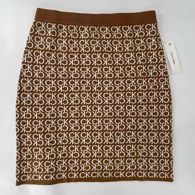 Falda Lápiz Calvin Klein CK Monograma Logo Tostado Blanco Elastizado Tejido Grande Precio de venta sugerido por el fabricante 80 USD Foto 1 de 4