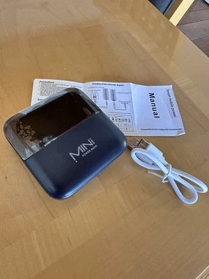 MINI Power Bank with USB Cable and Manual - Image 1 of 4