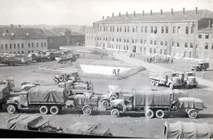 T1-80400 WWII Photo US Army Trucks on German Military Training Base w/ barracks - Picture 1 of 1