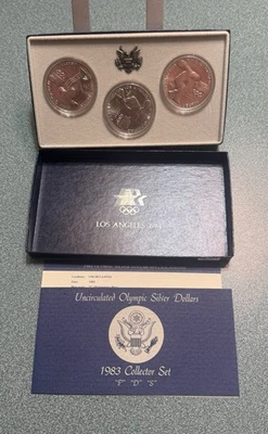 Dólar de plata olímpico 1983 P D & S sin circular conjunto de 3 monedas caja y certificado de autenticidad EE. UU. Como nuevo Foto 1 de 3