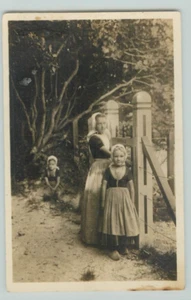 POSTCARD Children in Netherlands costume, Garden, portrait RPPC - Picture 1 of 2