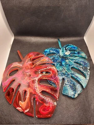 Pair Of Resin Blue/ Silver Metal Flake & Red/White Swirl Monstera Leaves - Image 1 of 4