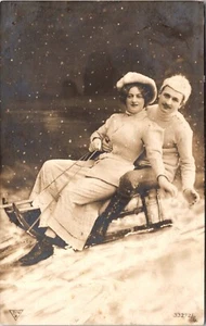 SLEDDING SCENE : SPORTS : ROMANCE : ANTIQUE SLED : CHRISTMAS SEAL : RPPC 1910 - Picture 1 of 3