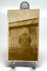 WW1 U.S. Doughboy Arms Behind Back Standing By Wood Structure