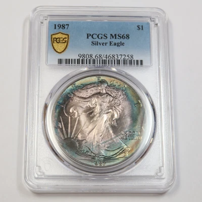 1987 PCGS MS68 TONED Silver American Eagle - US 1 oz SAE Coin $1 #42717A - Image 1 of 4