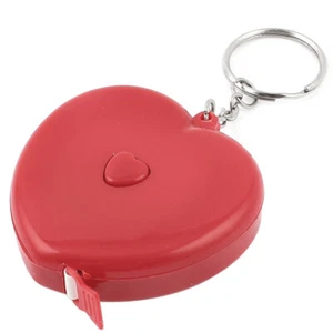 Regla de cinta métrica retráctil llavero con carcasa en forma de corazón de plástico rojo de 1,5 m - Imagen 1 de 2