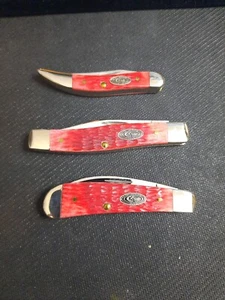 2009 Case CCC Rogers Jigged Dark Red Bone Jr., Reg. & Life Member Knives W/ Tins - Picture 1 of 11