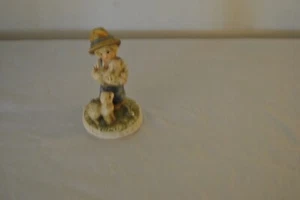 Ceramic Boy holding a sheep and a sheep by his feet - Picture 1 of 12