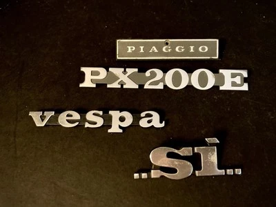 4 Piece Lot: Piagio, Vespa, PX200E & Si Badges Metal & Plastic “Piagio” Badge - Image 1 of 3