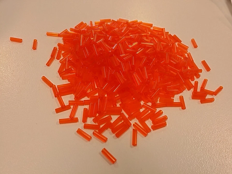 Glass Bugle Beads, Orange, seed beads about 6mm X 1.8mm, Hole .6mm 30 grams - Image 1 of 1
