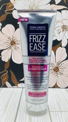 Acondicionador inmune John Frieda Beyond Smooth Frizz 8,45 oz Foto 1 de 4