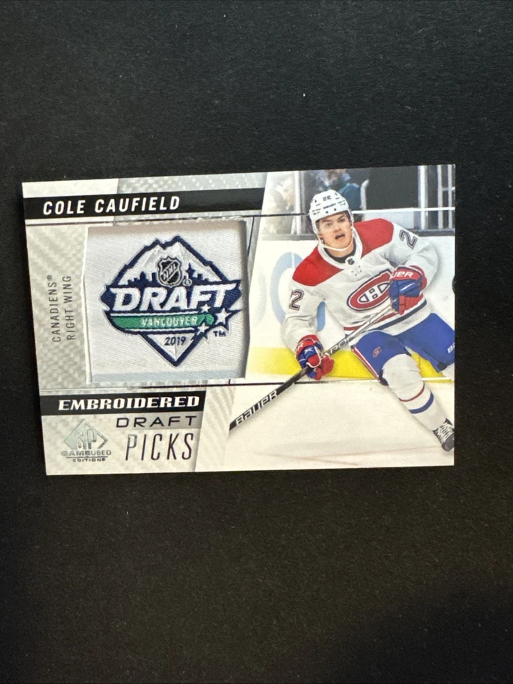 21-22 UD SP Game Used Hockey RC Embroidered Draft Picks 100 Cole Caufield - Image 1 of 2